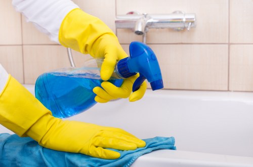 Cleaner working in a SW4 flat with routine upkeep